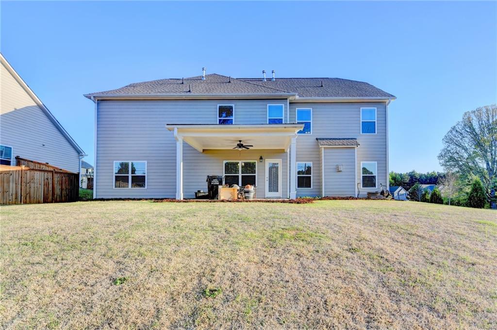 4548 Red Blossom Trail Southwest Powder Springs, GA 30127 - Photo 70 of 72 a front view of a house with a yard and garage