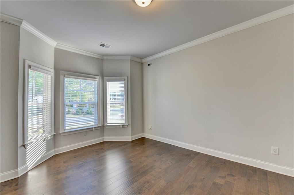 4548 Red Blossom Trail Southwest Powder Springs, GA 30127 - Photo 8 of 72 wooden floor in an empty room with a window