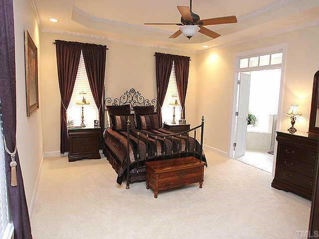 11523 South Lowell Road Bahama, NC 27503 - Photo 8 of 10 Master bedroom with treyed ceilings, transome window & crown molding