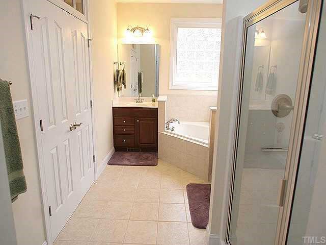 11523 South Lowell Road Bahama, NC 27503 - Photo 9 of 10 Master bath with separate showing and garden tub, double vanities, large walk-in closet