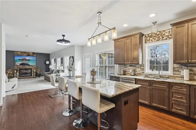 a kitchen with lots of counter top space and dining table