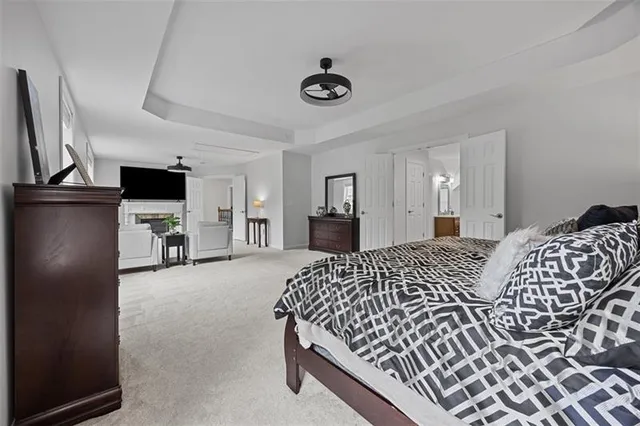 a bedroom with a bed and a television