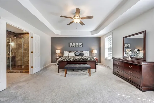 a bed room with a bed and a chandelier