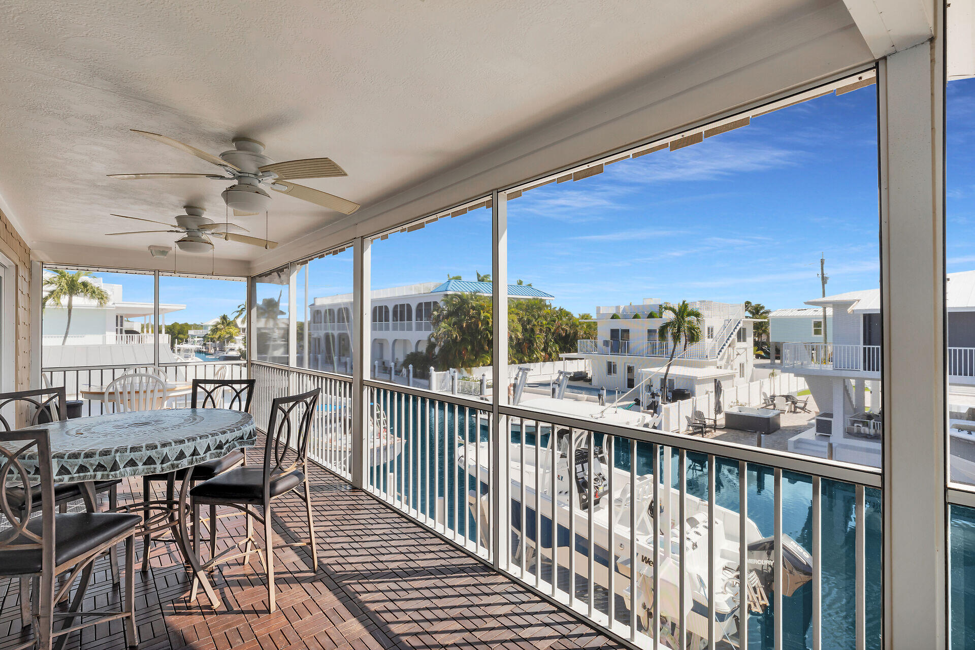 119 Primrose Lane Long Key, FL 33001 - Photo 29 of 43 a view of a balcony dining table and chairs
