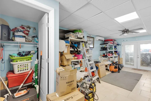 a children room with toys and a fan