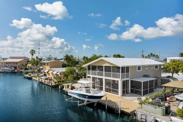 a view of a lake with a barbeque and a stove