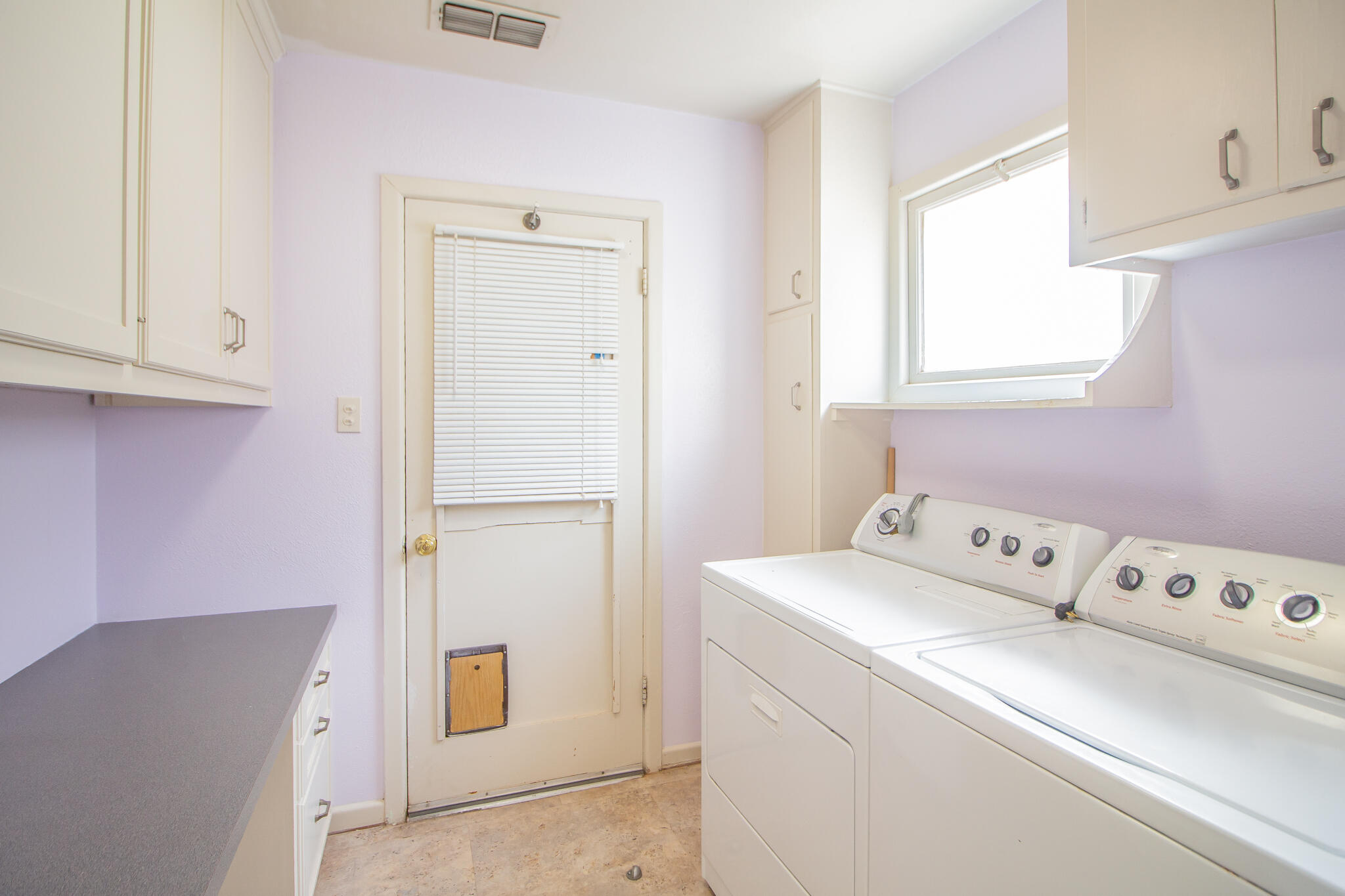 2806 58th Street Lubbock, TX 79413 - Photo 19 of 35 a utility room with dryer and washer