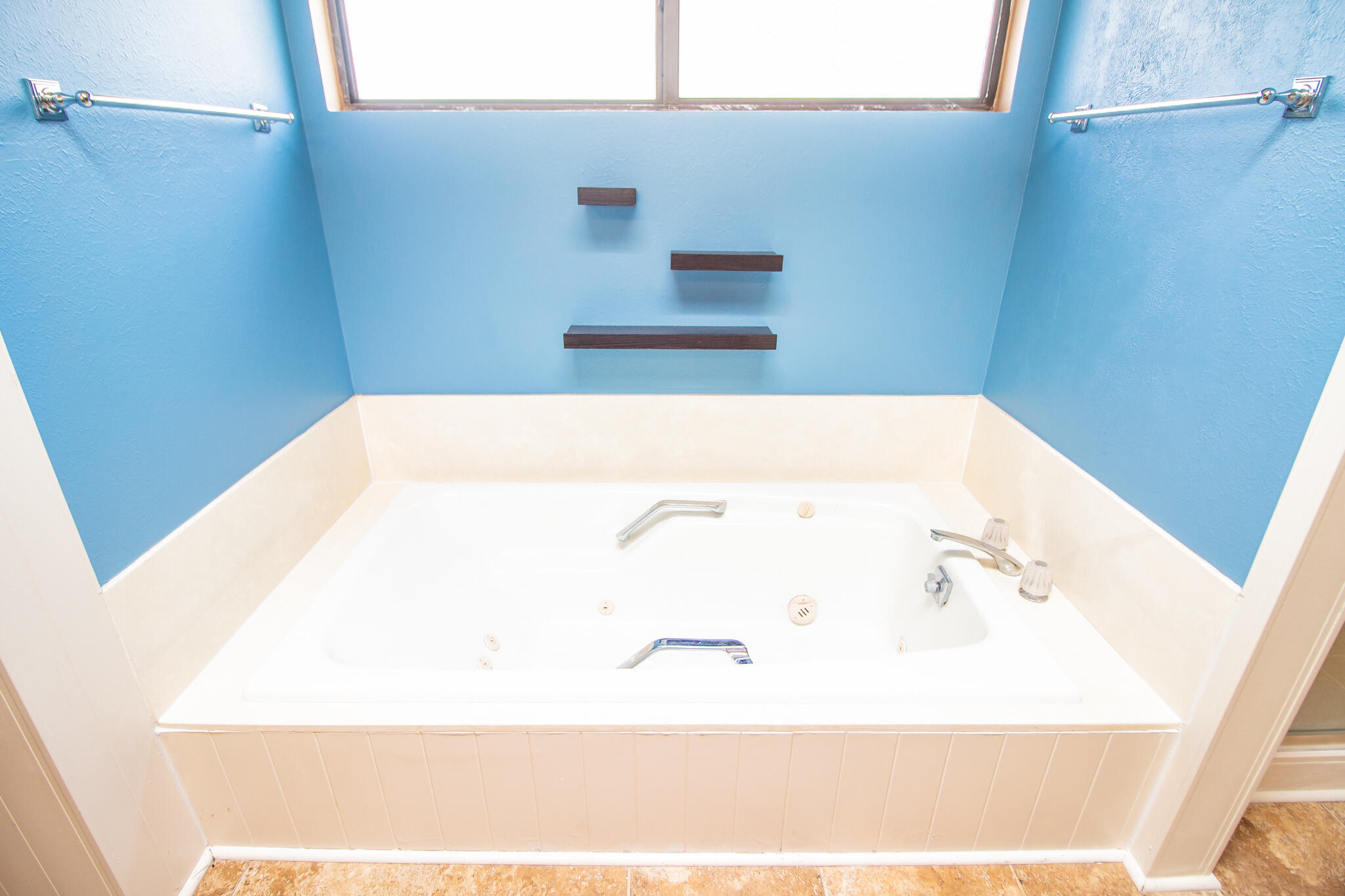 2806 58th Street Lubbock, TX 79413 - Photo 24 of 35 a close up of a bathtub in a bathroom