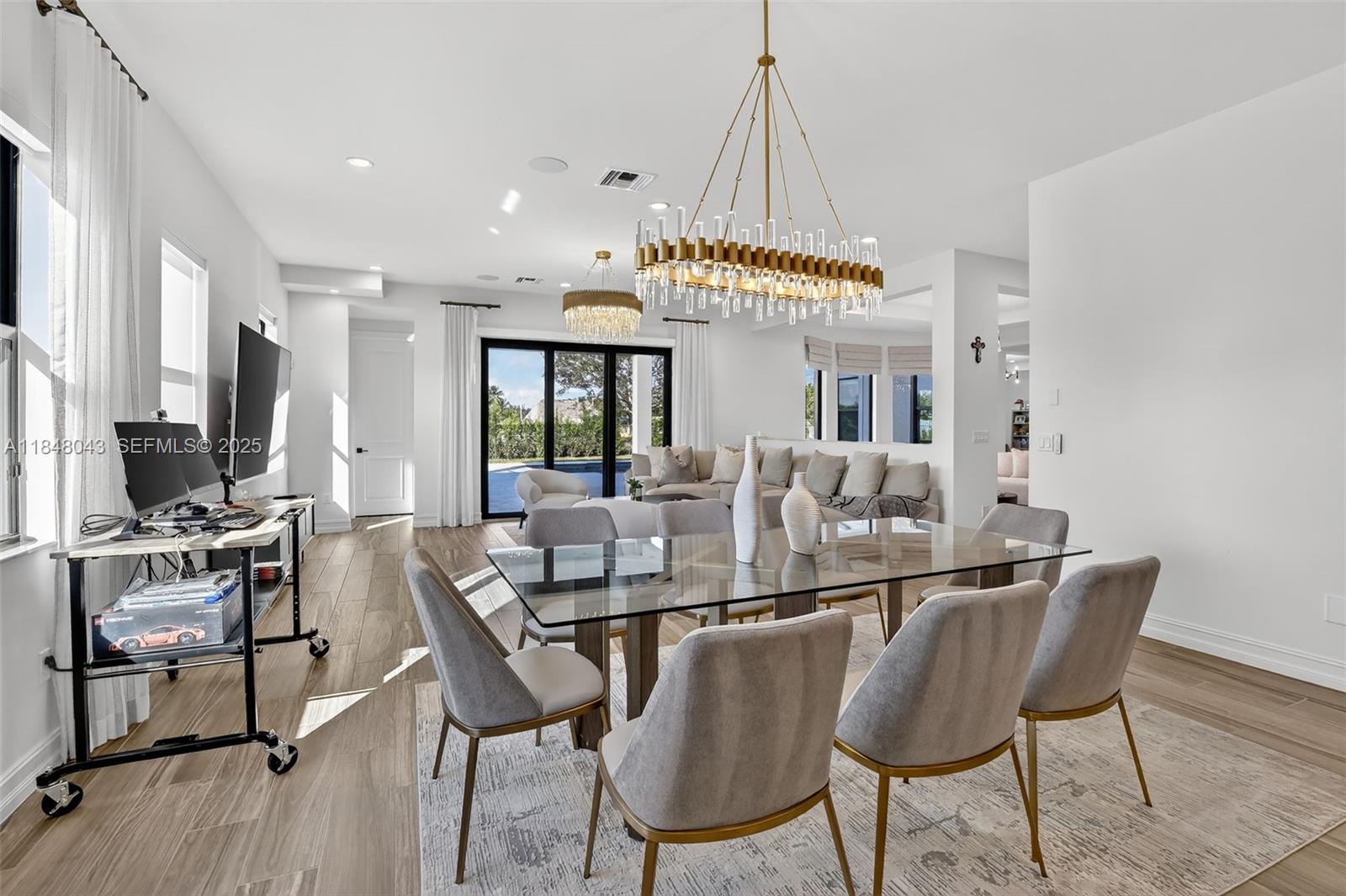 14855 Millstone Ranches Drive Davie, FL 33331 - Photo 22 of 94 a view of a dining room with furniture and a chandelier
