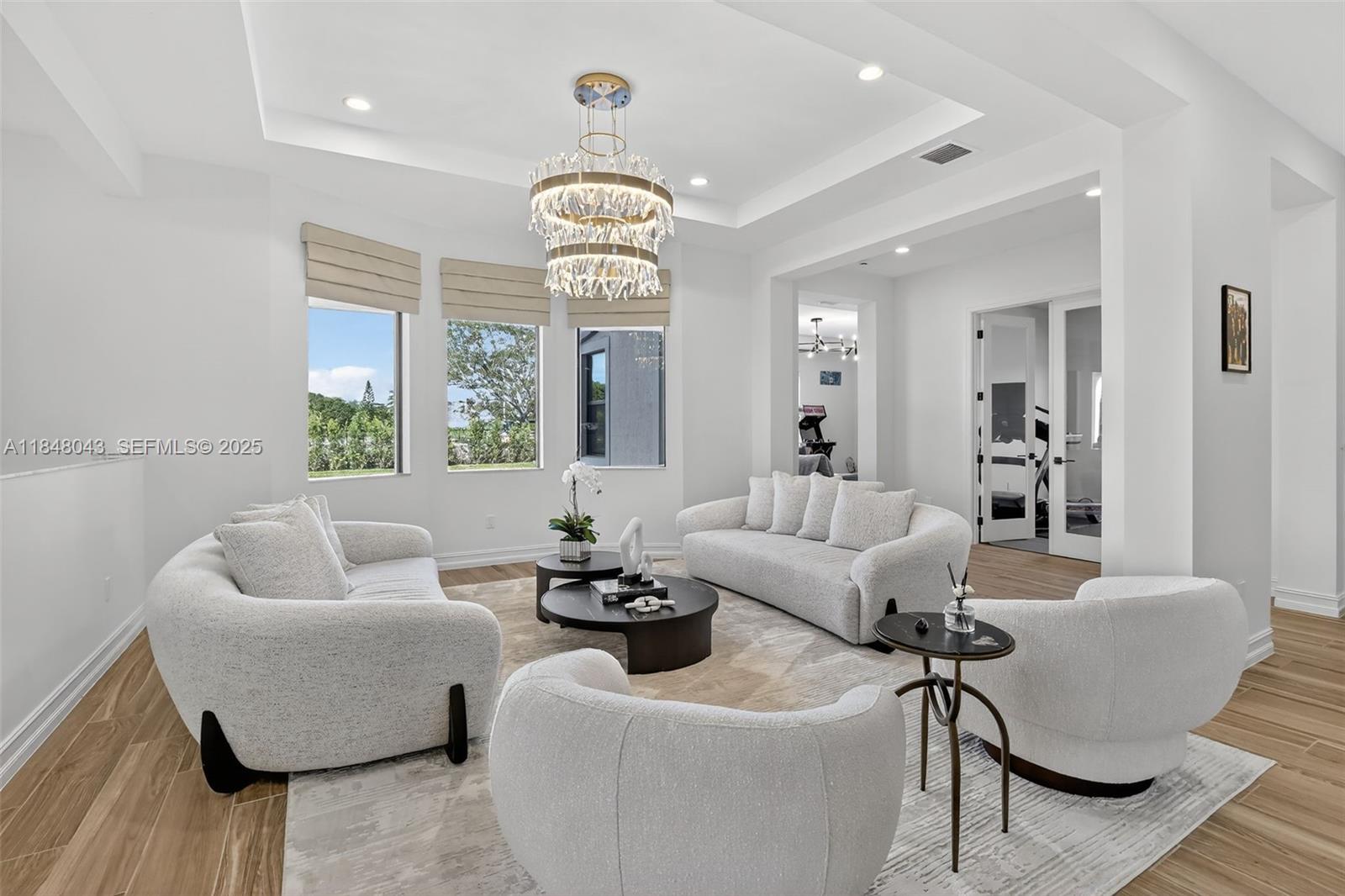 14855 Millstone Ranches Drive Davie, FL 33331 - Photo 23 of 94 a living room with furniture and a large window