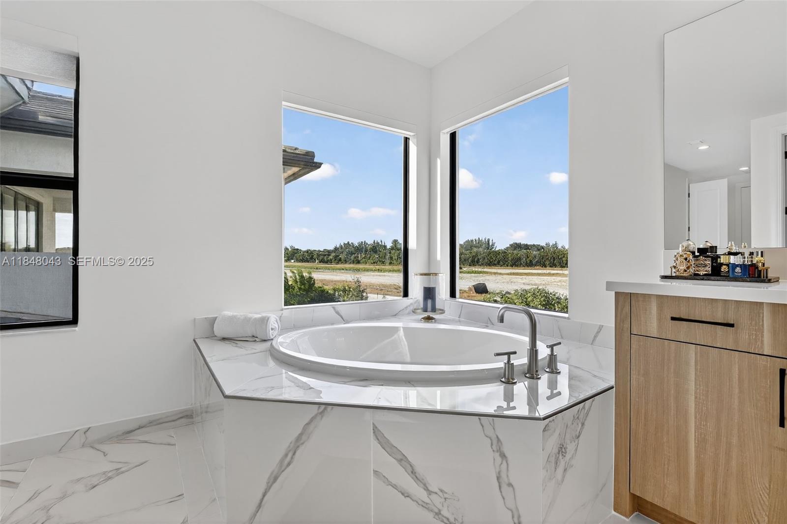 14855 Millstone Ranches Drive Davie, FL 33331 - Photo 30 of 94 a living room with furniture and a window