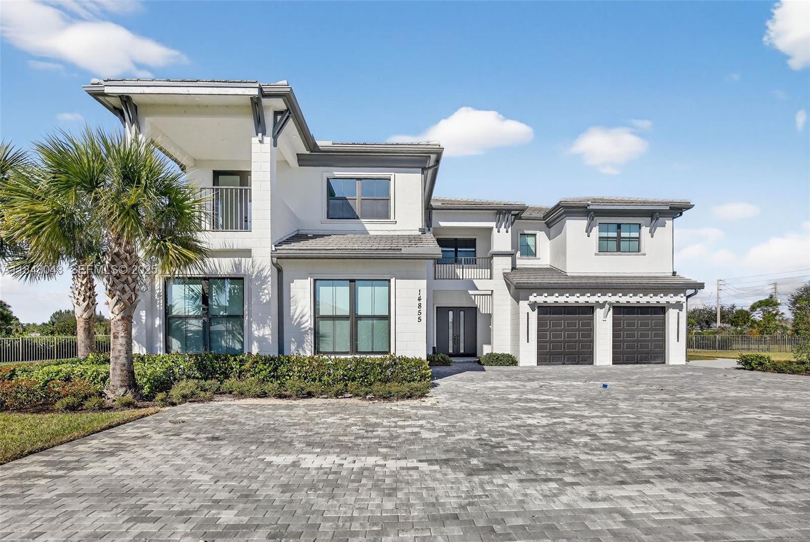 14855 Millstone Ranches Drive Davie, FL 33331 - Photo 3 of 94 a front view of a house with a garden