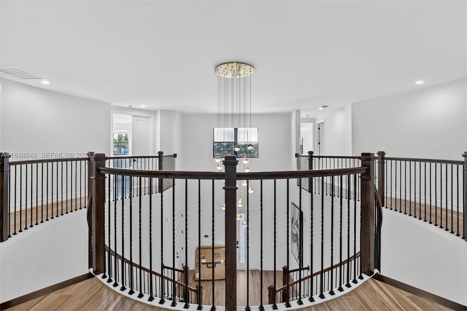 14855 Millstone Ranches Drive Davie, FL 33331 - Photo 39 of 94 a view of a hallway with wooden floor and staircase