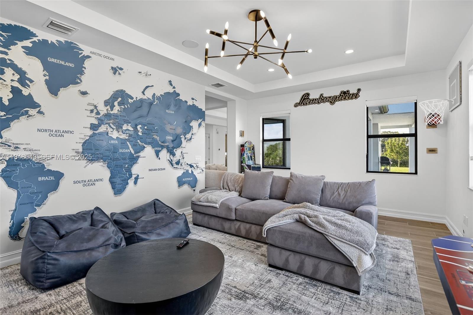 14855 Millstone Ranches Drive Davie, FL 33331 - Photo 47 of 94 a living room with furniture and a chandelier