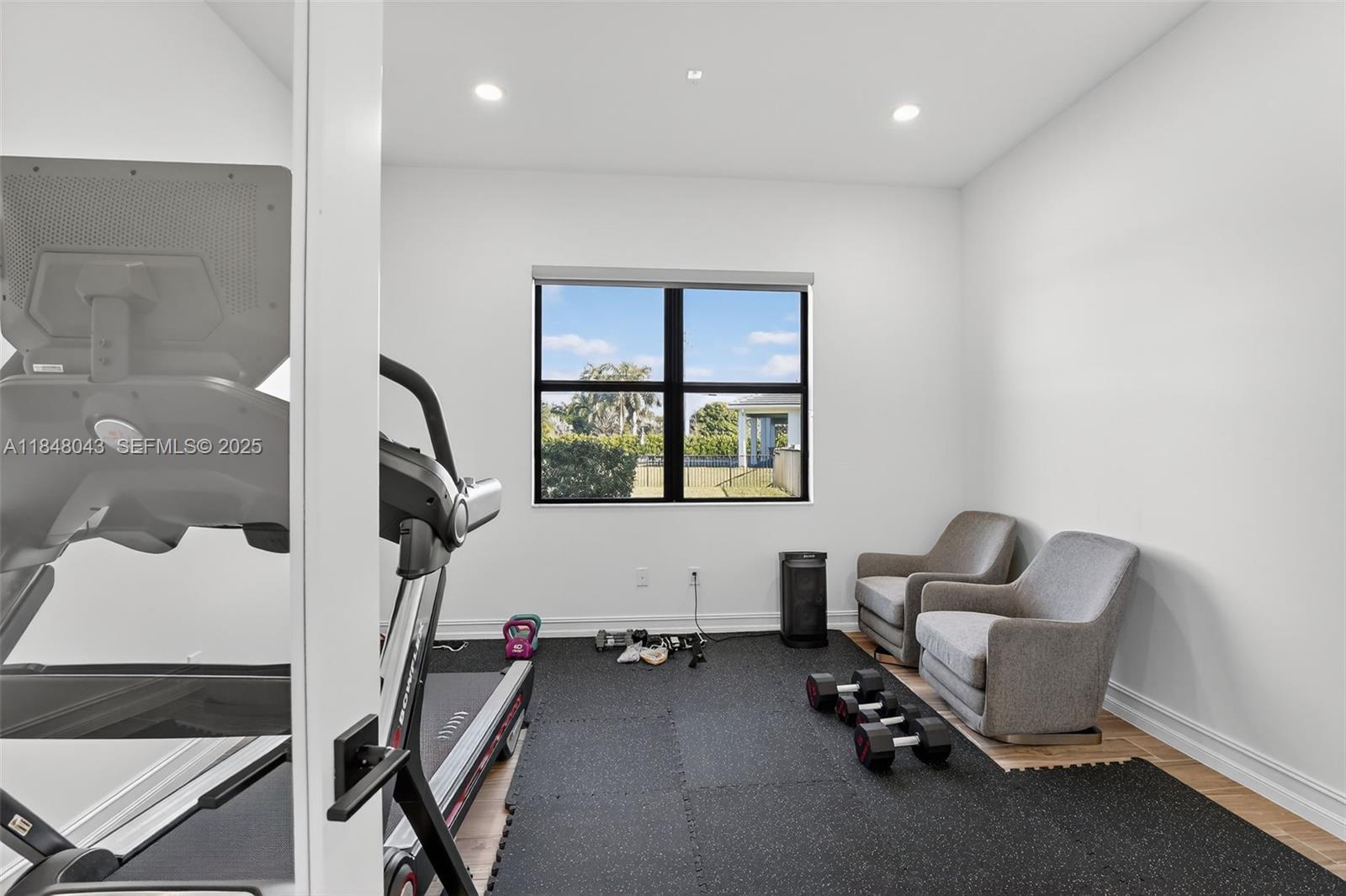 14855 Millstone Ranches Drive Davie, FL 33331 - Photo 52 of 94 a view of a room with gym equipment