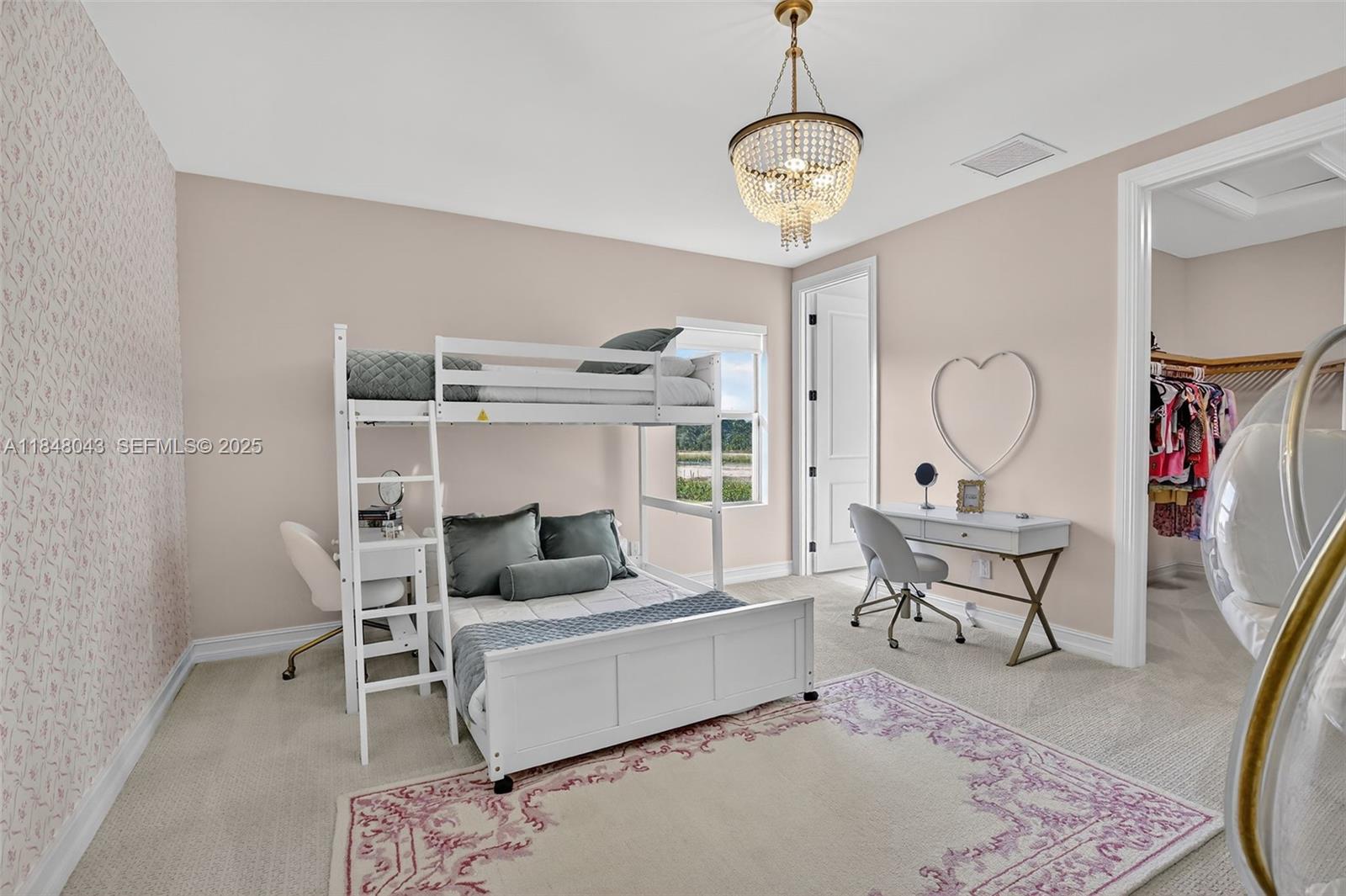 14855 Millstone Ranches Drive Davie, FL 33331 - Photo 55 of 94 a living room with furniture a rug and a chandelier