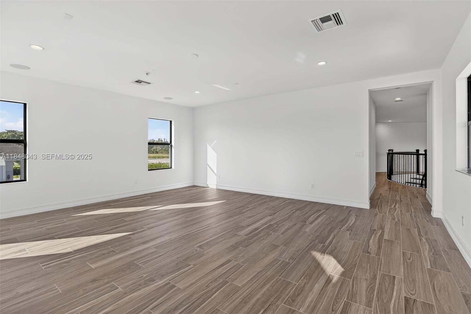 14855 Millstone Ranches Drive Davie, FL 33331 - Photo 59 of 94 wooden floor in an empty room with a window