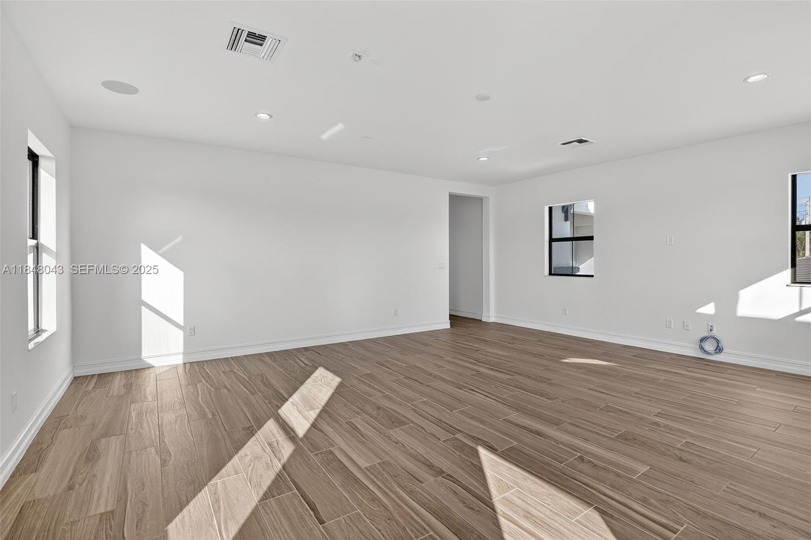 14855 Millstone Ranches Drive Davie, FL 33331 - Photo 60 of 94 a view of empty room with wooden floor and fan