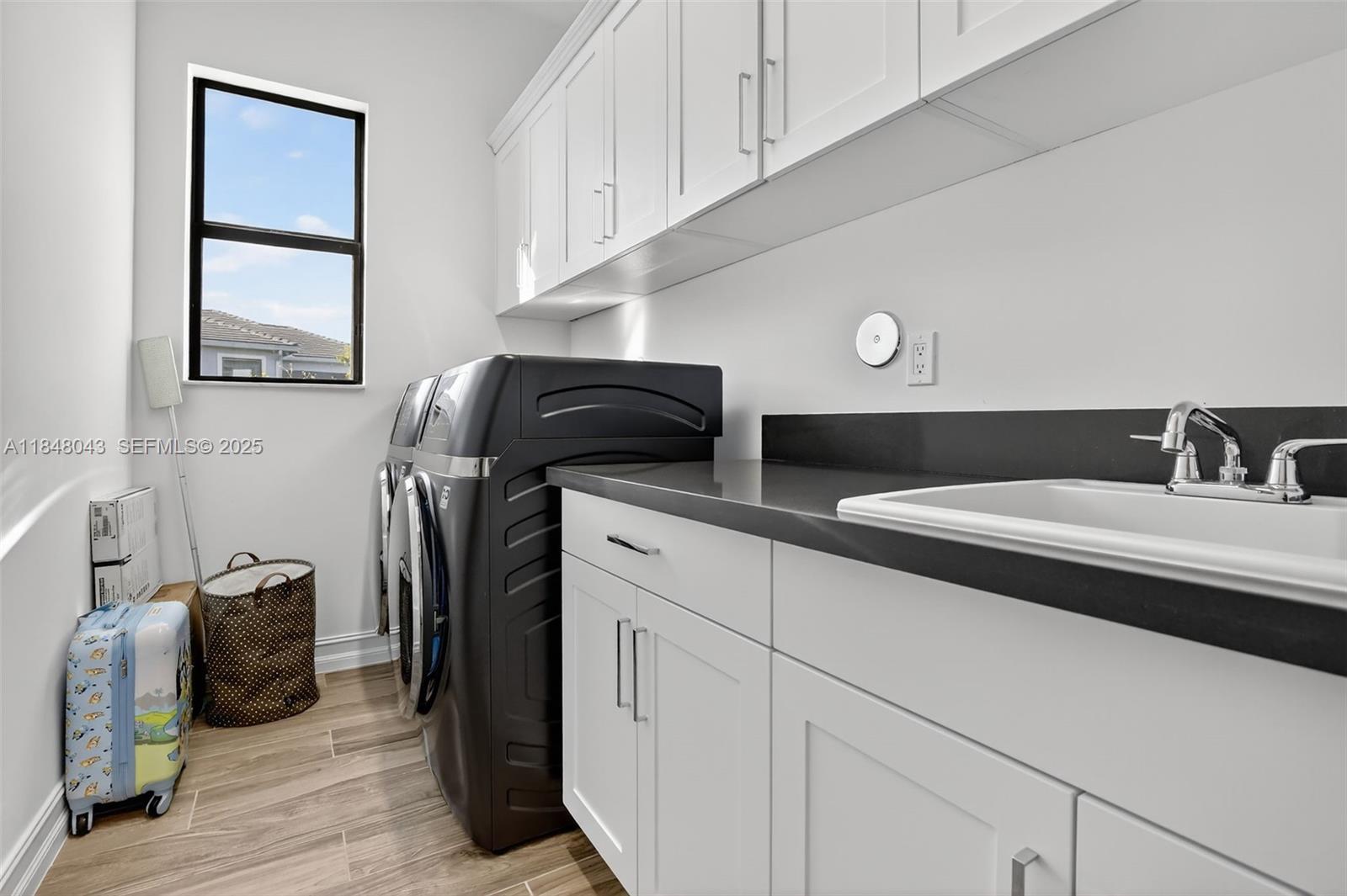 14855 Millstone Ranches Drive Davie, FL 33331 - Photo 67 of 94 a bathroom with a sink and a mirror