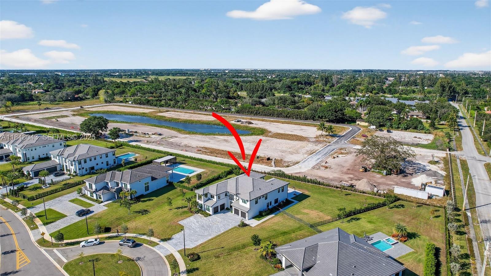 14855 Millstone Ranches Drive Davie, FL 33331 - Photo 79 of 94 an aerial view of a house with a swimming pool