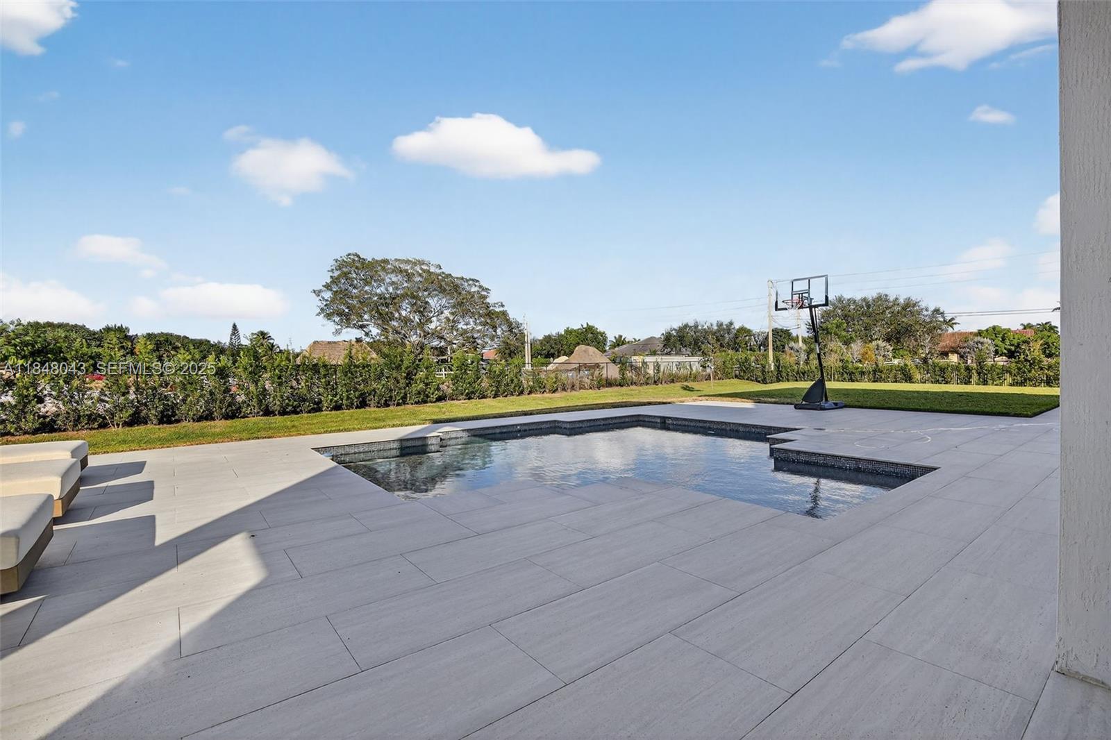 14855 Millstone Ranches Drive Davie, FL 33331 - Photo 82 of 94 a view of swimming pool with outdoor seating and yard in back