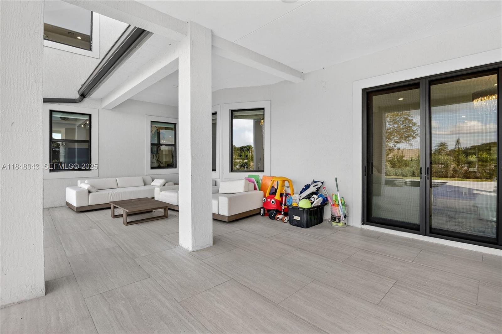 14855 Millstone Ranches Drive Davie, FL 33331 - Photo 86 of 94 a view of a livingroom with furniture and windows