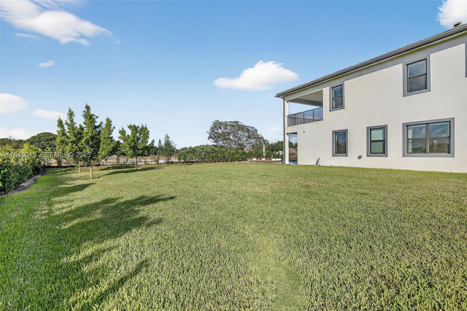 14855 Millstone Ranches Drive Davie, FL 33331 - Photo 89 of 94 a front view of a house with a yard