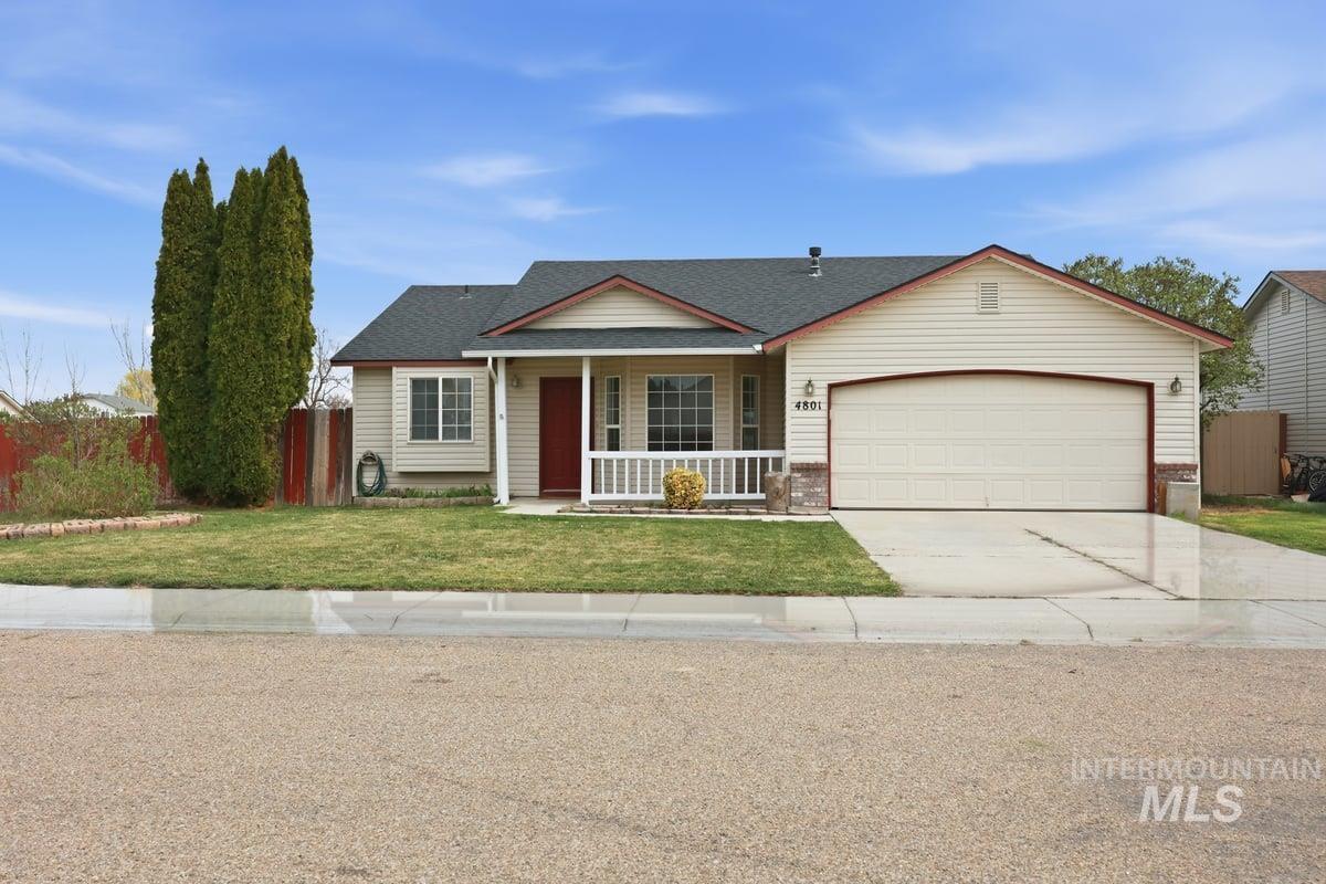 View of front of home featuring covered porch, driveway, a garage, and roof with shingles