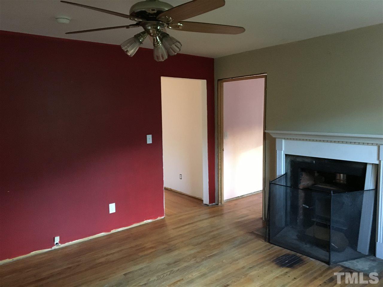 9516 Virgilina Road Roxboro, NC 27574 - Photo 20 of 21 a view of a livingroom with a fireplace