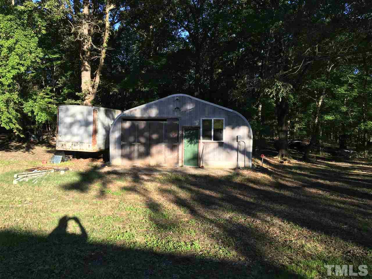 9516 Virgilina Road Roxboro, NC 27574 - Photo 6 of 21 a view of a yard in front of the house