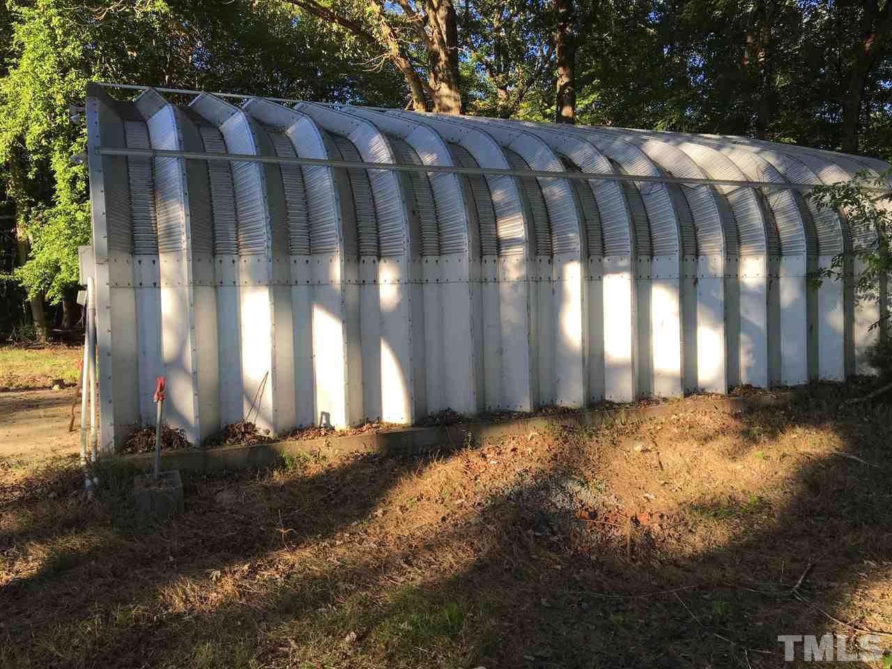 9516 Virgilina Road Roxboro, NC 27574 - Photo 7 of 21 a view of a yard with wooden fence