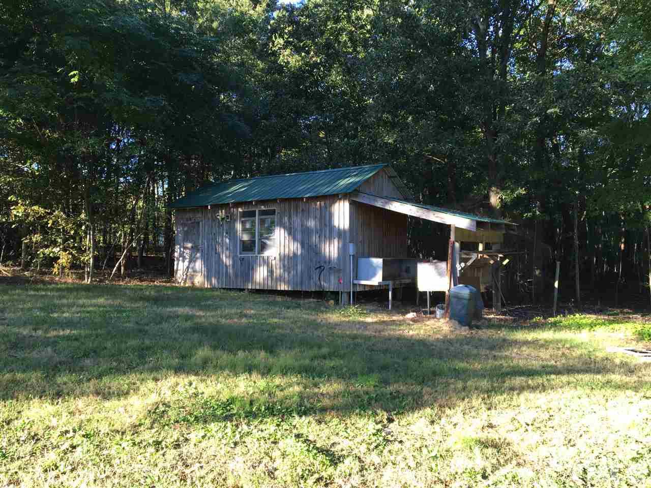 9516 Virgilina Road Roxboro, NC 27574 - Photo 8 of 21 a view of a house with a yard