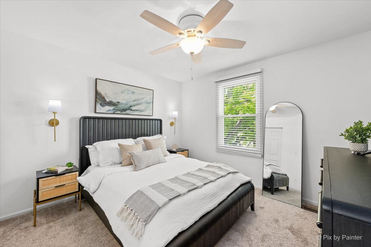 1150 Appleton Lane Geneva, IL 60134 - Photo 8 of 43 a bedroom with a bed and a chandelier