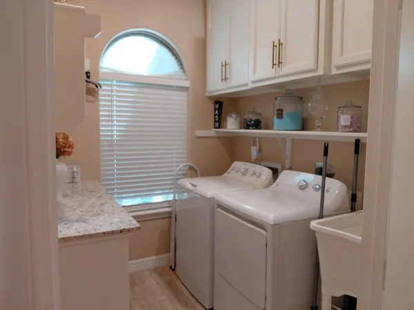 a utility room with dryer and washer