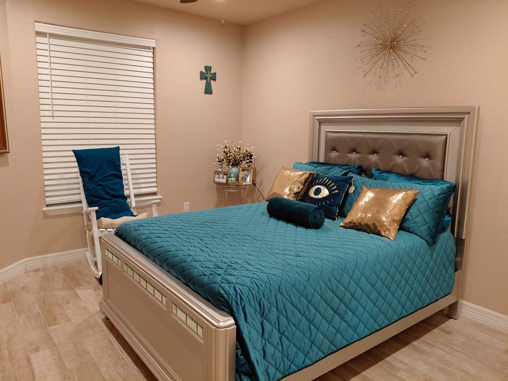 309 Hickman Lane Angleton, TX 77515 - Photo 15 of 33 a bedroom with a bed and a window