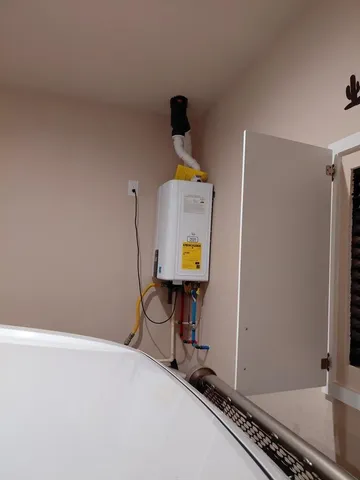 a bathroom with a sink toilet and mirror