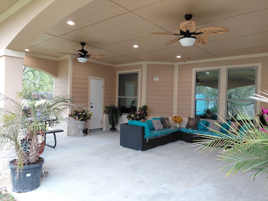 309 Hickman Lane Angleton, TX 77515 - Photo 24 of 33 a living room with furniture and a chandelier
