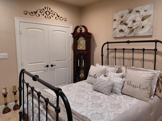 a bedroom with bed and furniture