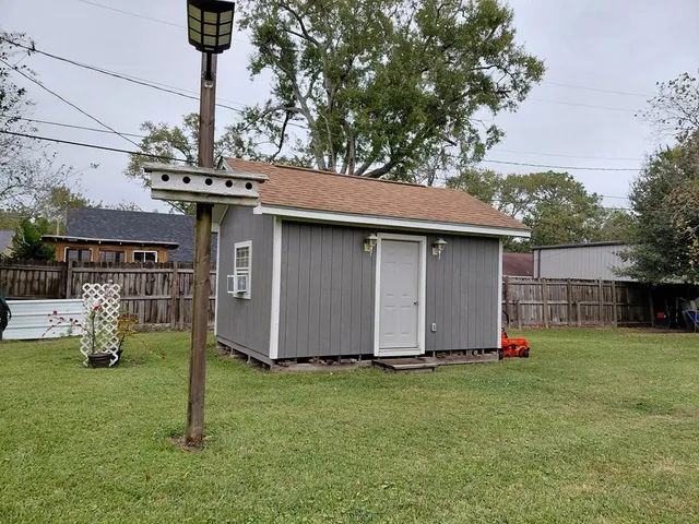 a view of a backyard with a barn