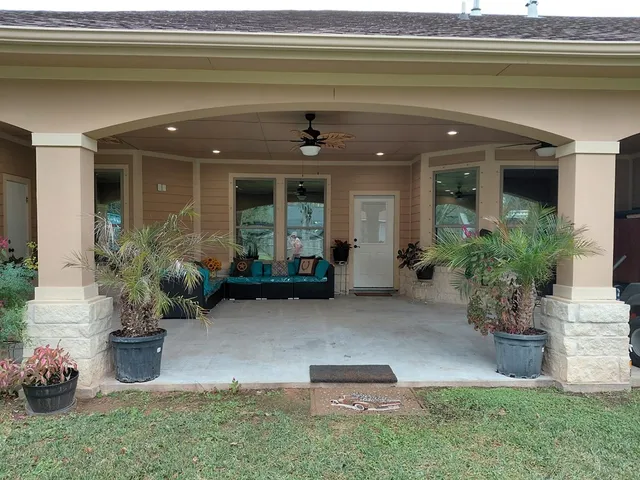 a view of a porch with seating space