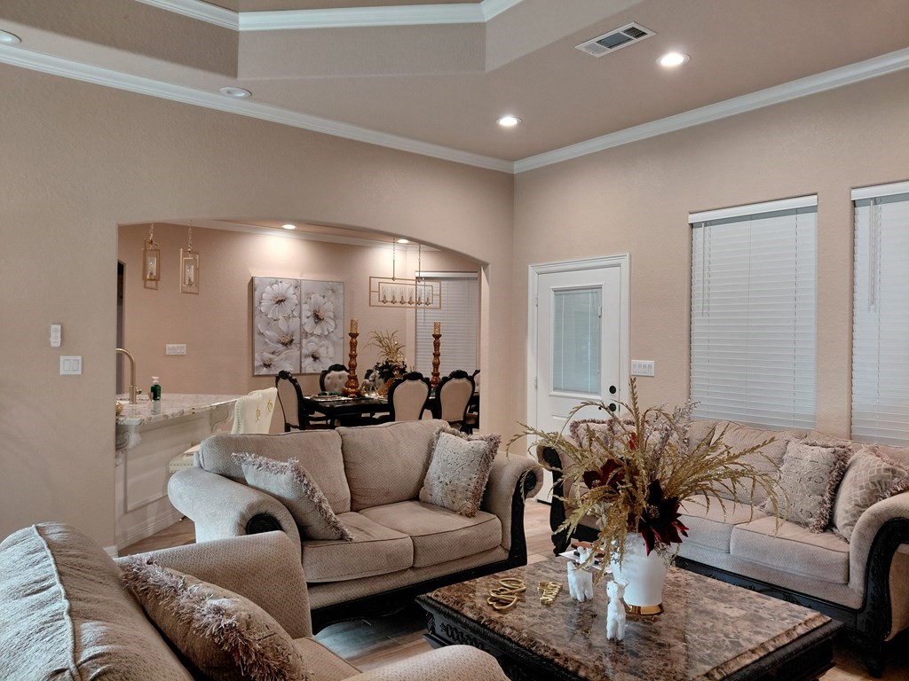 309 Hickman Lane Angleton, TX 77515 - Photo 6 of 33 a living room with furniture and a large mirror