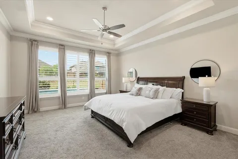 a bedroom with a bed next to a window with outer view