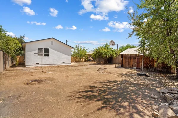 a view of a backyard of the house