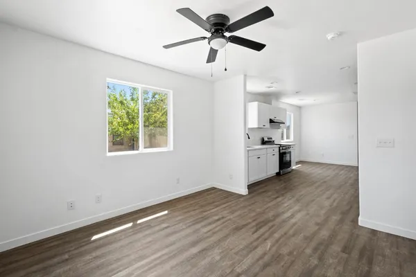 a view of a kitchen with a sink and a window