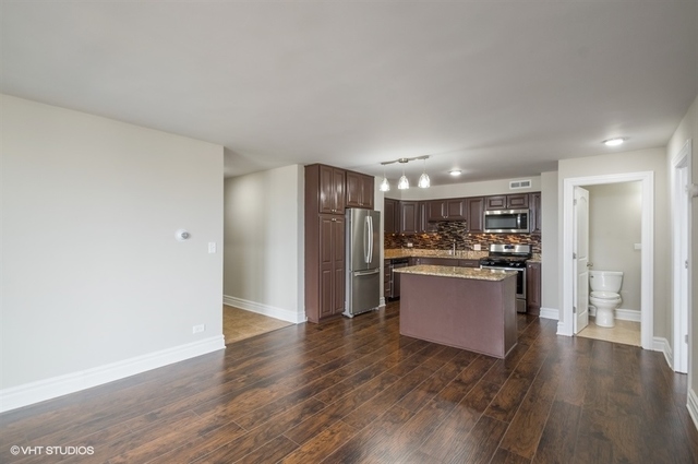 6325 North Sheridan Road, Unit 1005 Chicago, IL 60660 - Photo 11 of 24 a large kitchen with a refrigerator and a sink