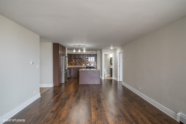 6325 North Sheridan Road, Unit 1005 Chicago, IL 60660 - Photo 12 of 24 a view of a living room and kitchen with wooden floor
