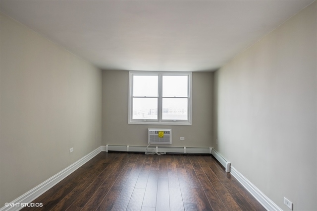 6325 North Sheridan Road, Unit 1005 Chicago, IL 60660 - Photo 19 of 24 an empty room with wooden floor and windows