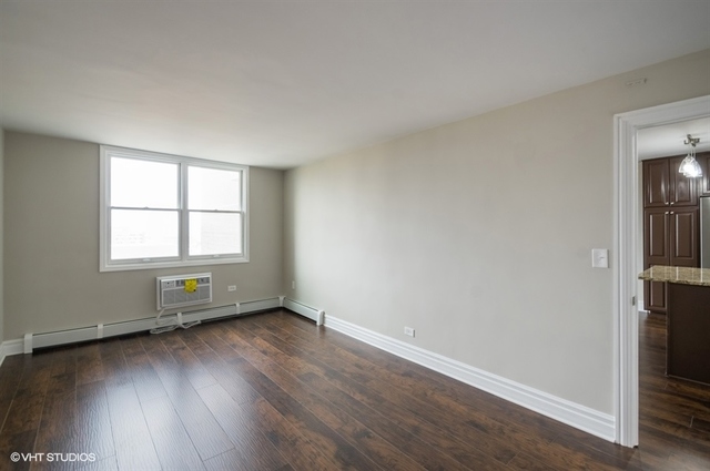 6325 North Sheridan Road, Unit 1005 Chicago, IL 60660 - Photo 20 of 24 an empty room with wooden floor and windows