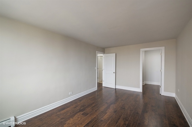 6325 North Sheridan Road, Unit 1005 Chicago, IL 60660 - Photo 21 of 24 a view of an empty room with wooden floor