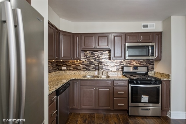 6325 North Sheridan Road, Unit 1005 Chicago, IL 60660 - Photo 6 of 24 a kitchen with stainless steel appliances a stove and a sink